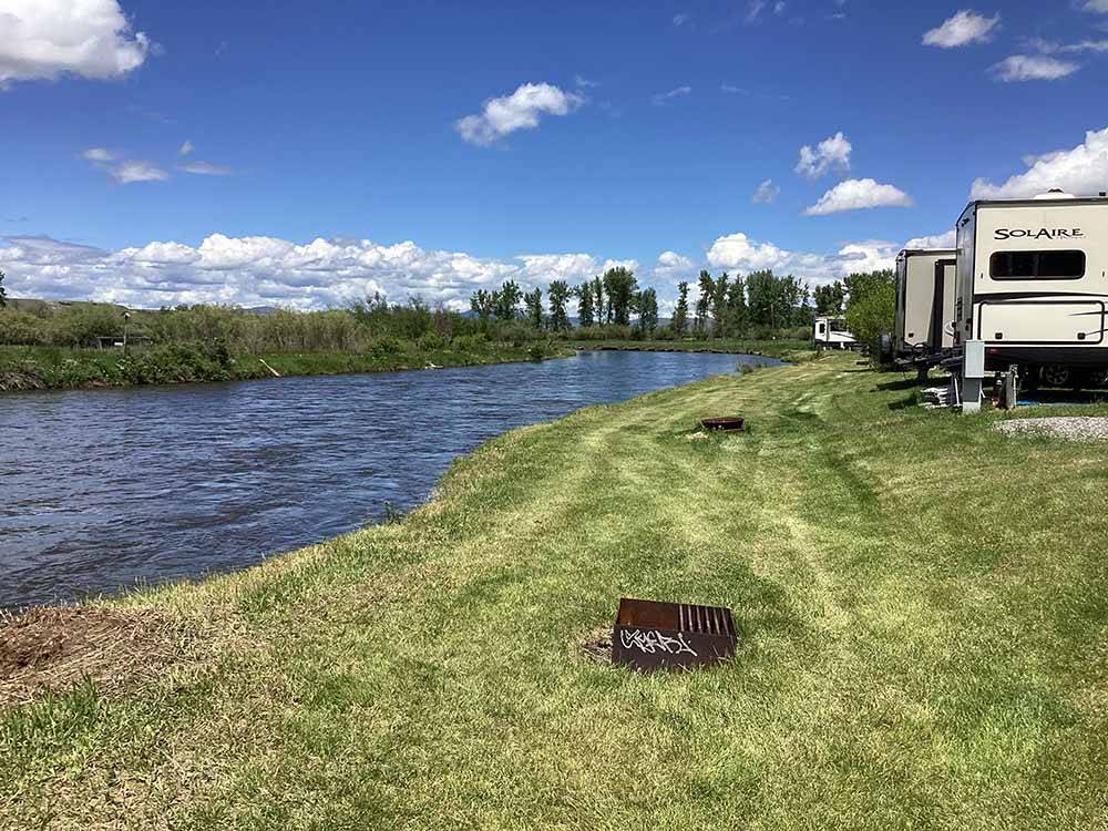 The RV sites by the river at DEER LODGE A-OK CAMPGROUND