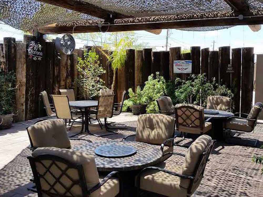 A covered outdoor seating area awaits you at HITCHIN' POST RV PARK