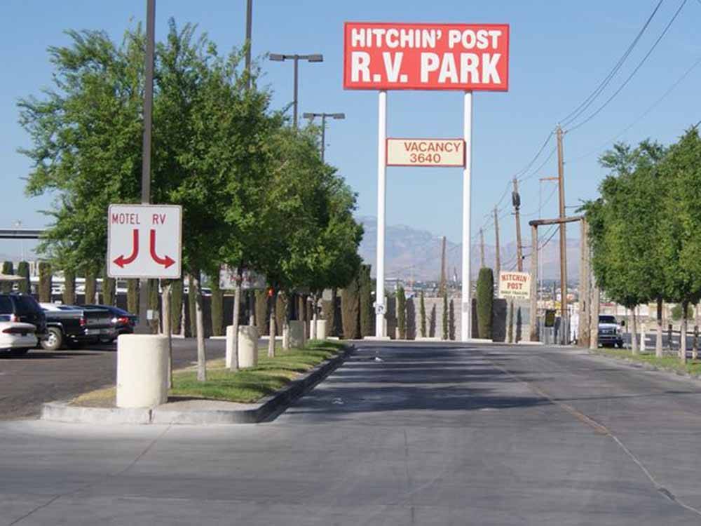 The front entrance with a tall sign at HITCHIN' POST RV PARK