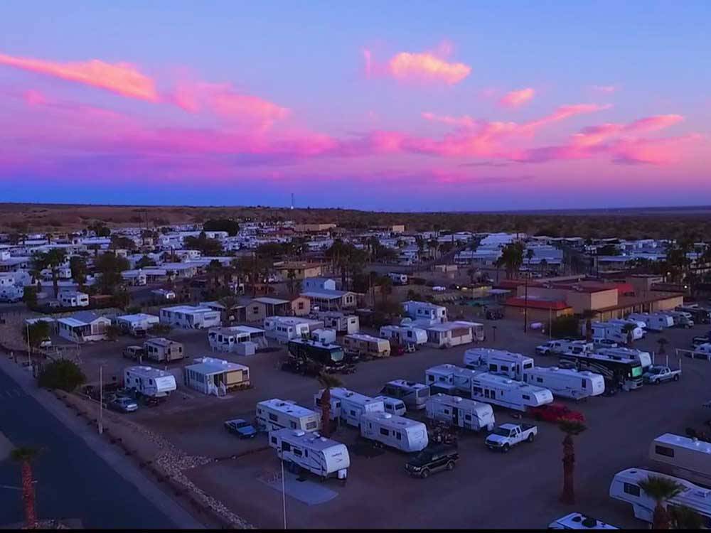 High level view of campground with beautiful pink sky at FOUNTAIN OF YOUTH SPA RV RESORT