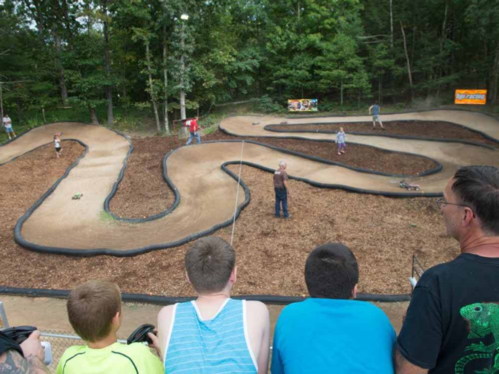 People driving R/C cars on a dirt track at RIP VAN WINKLE CAMPGROUNDS