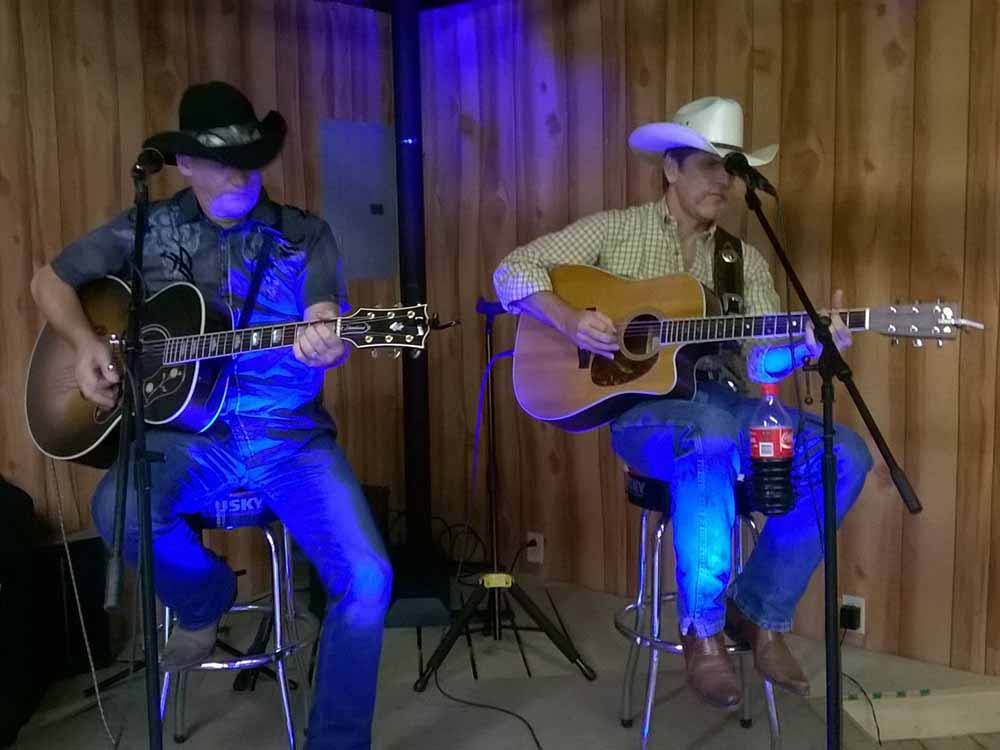 A duet playing guitars at NASHVILLE I-24 CAMPGROUND