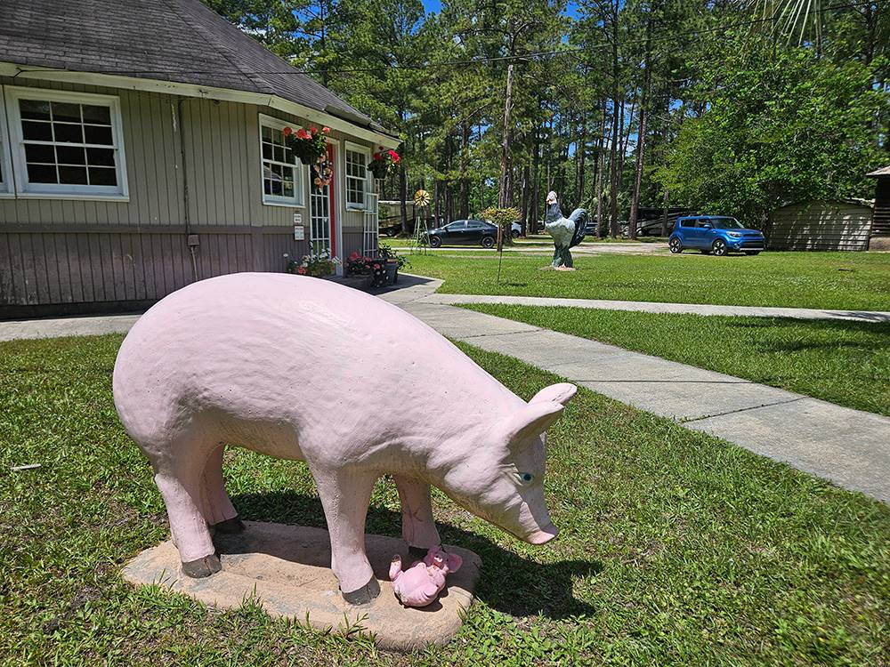 Statue of a pink pig at New Green Acres RV Park