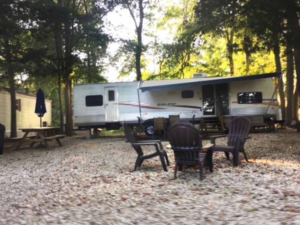 An RV site with chairs at KING NUMMY TRAIL CAMPGROUND