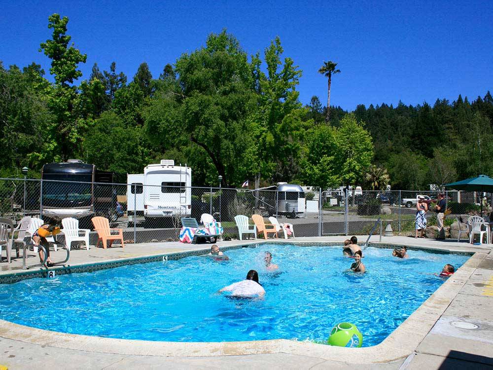 People swimming in the pool at SANTA CRUZ RANCH CAMPGROUND