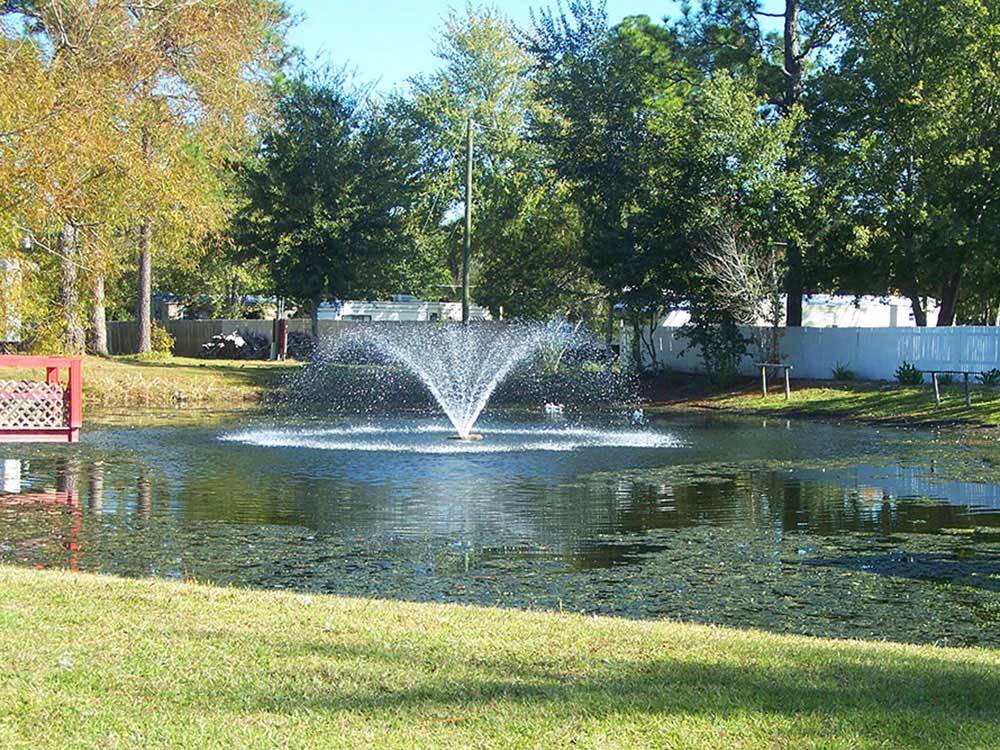 Lake view with spray fountain at LAKE CITY CAMPGROUND