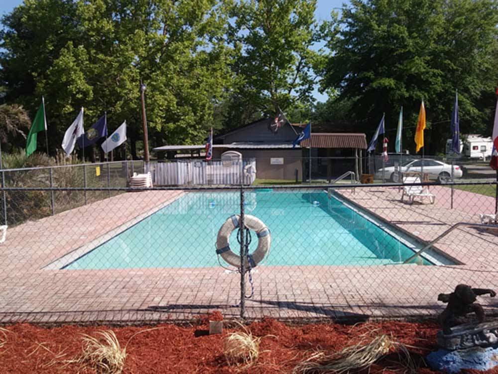 The fenced in swimming pool at LAKE CITY CAMPGROUND