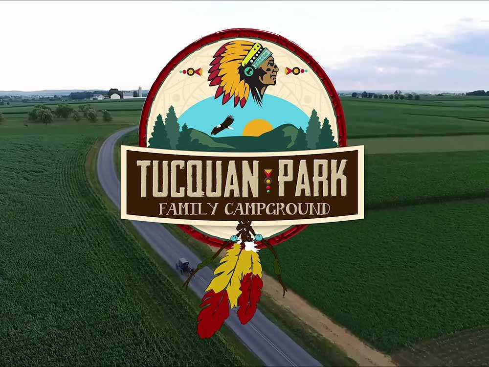 The park logo over a road at TUCQUAN PARK FAMILY CAMPGROUND