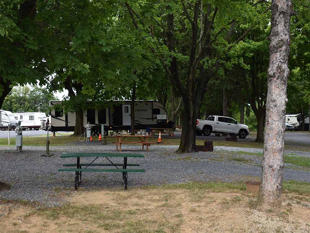 One of the gravel RV campsites with a picnic bench at HARRISBURG EAST CAMPGROUND & STORAGE