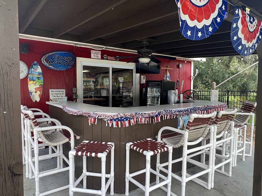 The bar area decorated for Fourth of July at SUGAR MILL RUINS TRAVEL PARK