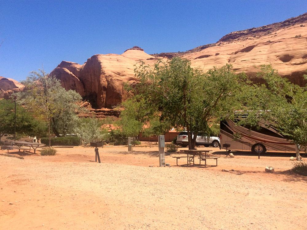 RV under a tree at GOULDING'S MONUMENT VALLEY CAMPGROUND & RV PARK