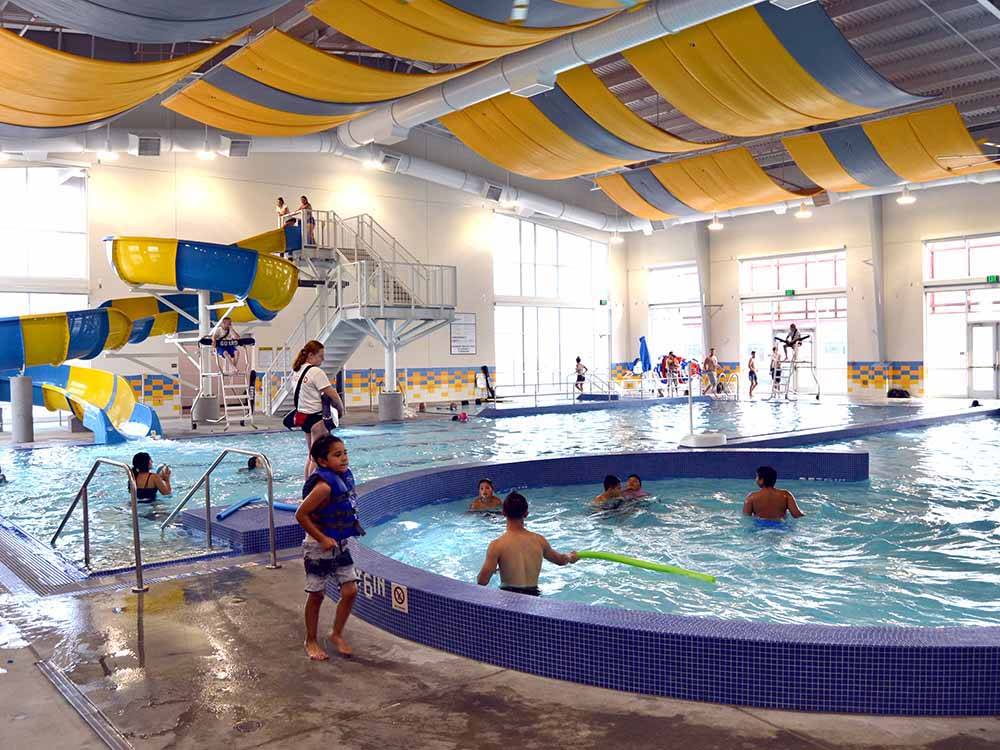 Kids enjoying the indoor swimming pool at BOARDMAN MARINA & RV PARK