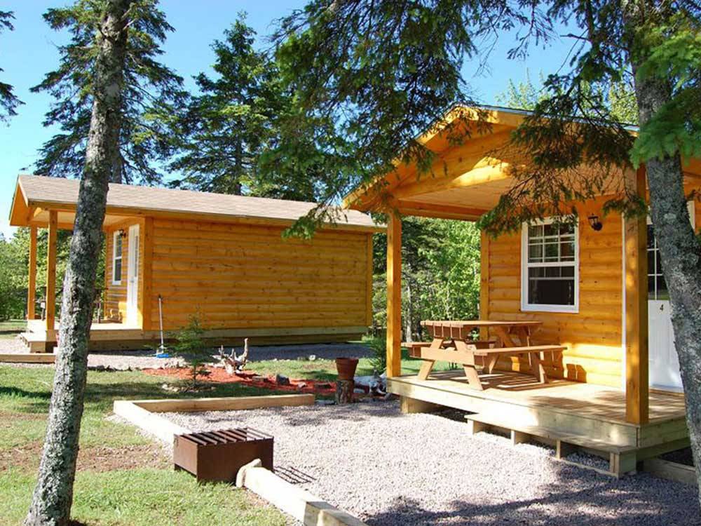 Log cabins with decks at BADDECK CABOT TRAIL CAMPGROUND
