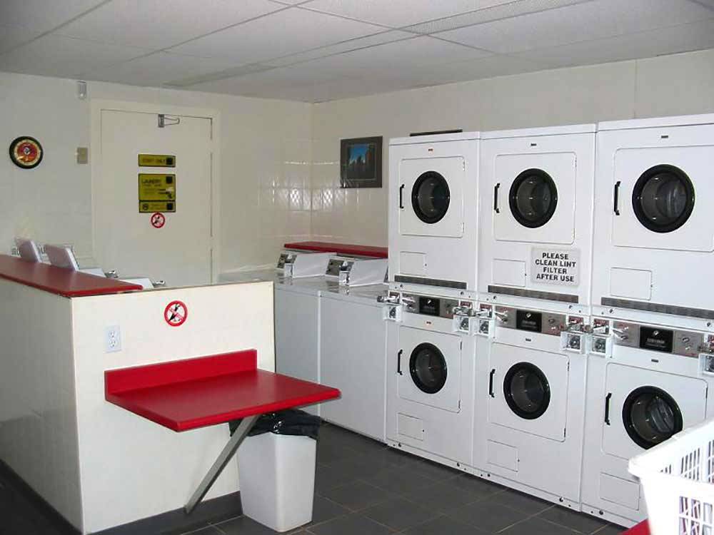 Laundry room with washer and dryers at BADDECK CABOT TRAIL CAMPGROUND