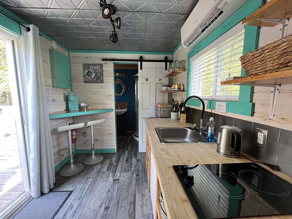 The kitchen area in one of the tiny houses at BADDECK CABOT TRAIL CAMPGROUND