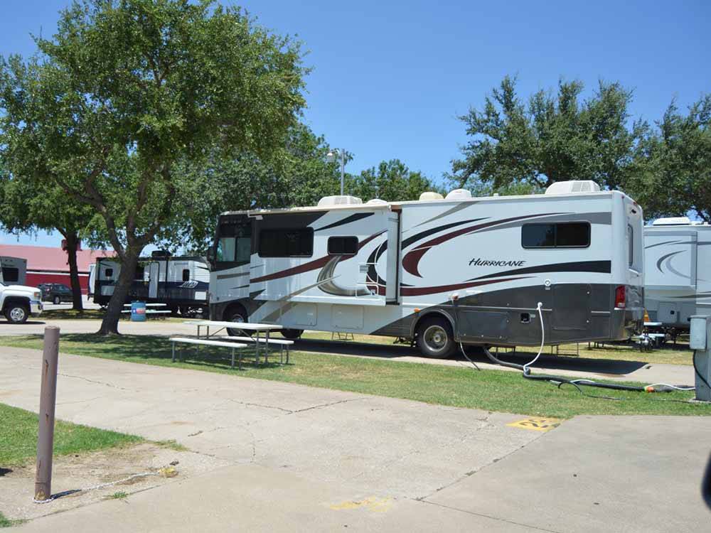 Class A motorhome hooked up in site at TRADERS VILLAGE RV PARK