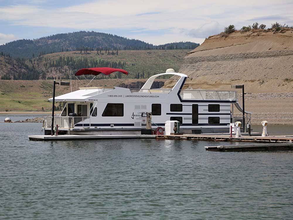 A tour boat docked at the marina at LAKE ROOSEVELT NRA/KELLER FERRY CAMPGROUND