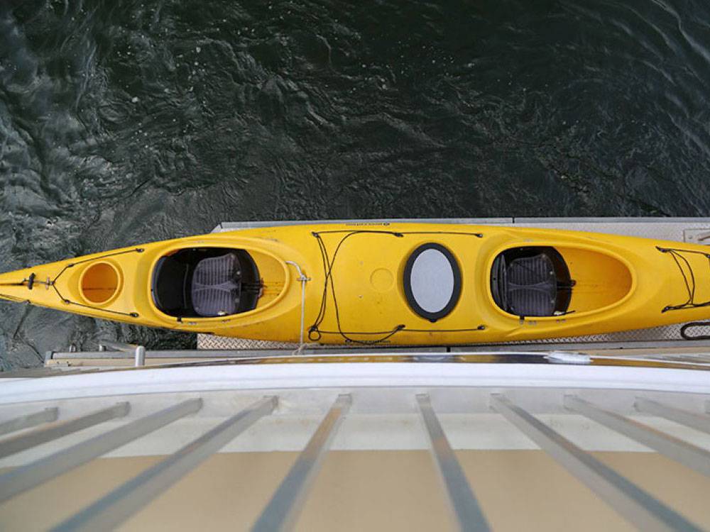 Kayak on the side of a boat