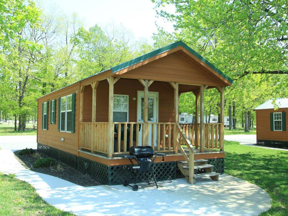 A rental cabin with porch and grill