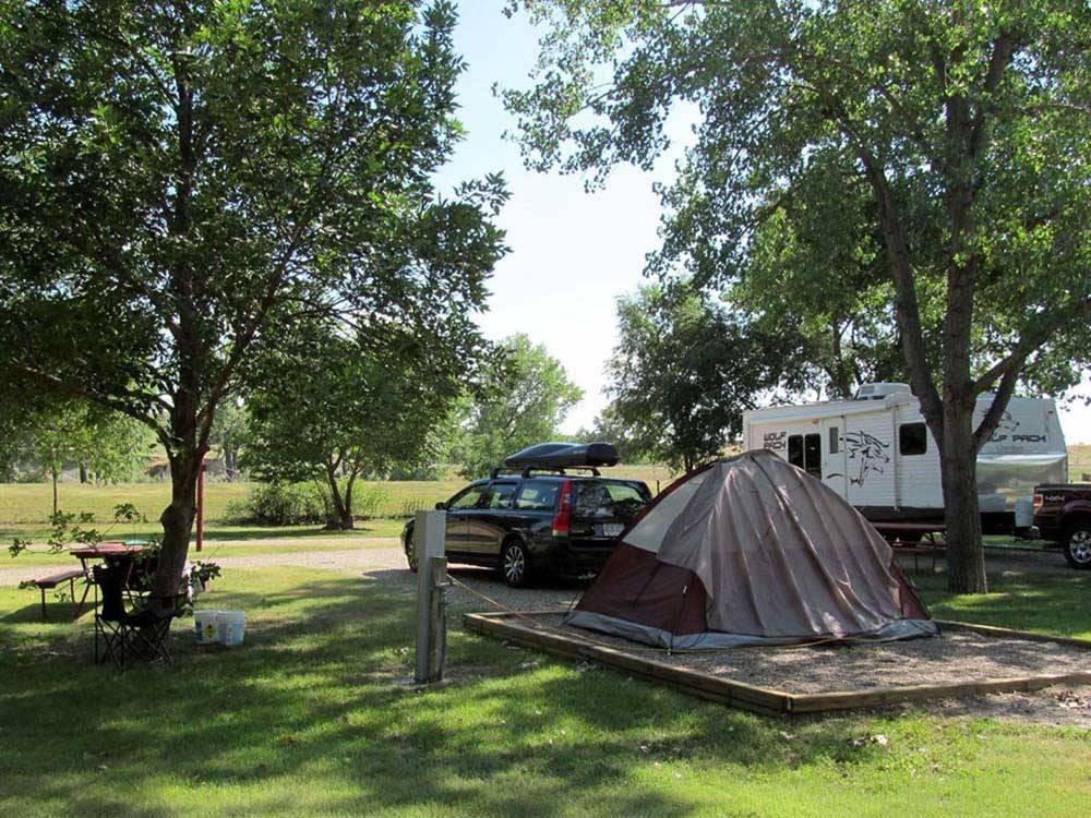 A tent pitched up in a gravel spot at BADLANDS / WHITE RIVER KOA HOLIDAY
