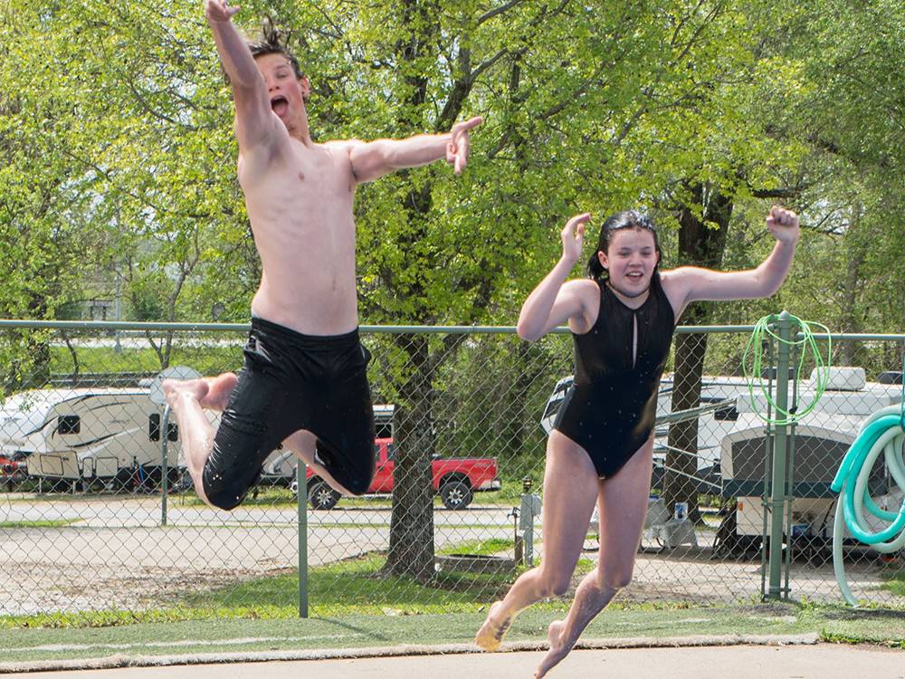 People jumping in the pool