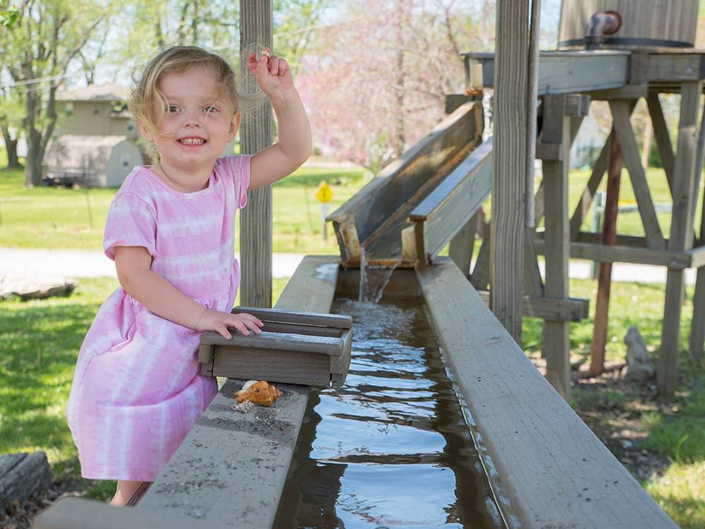 A child using the gem sluice