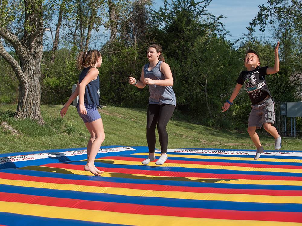 A group of kids on the bounce pillow