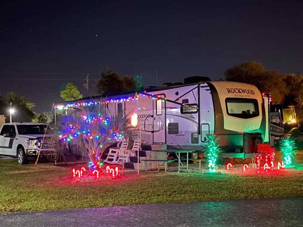 A travel trailer decorated for Christmas at CYPRESS CAMPGROUND & RV PARK