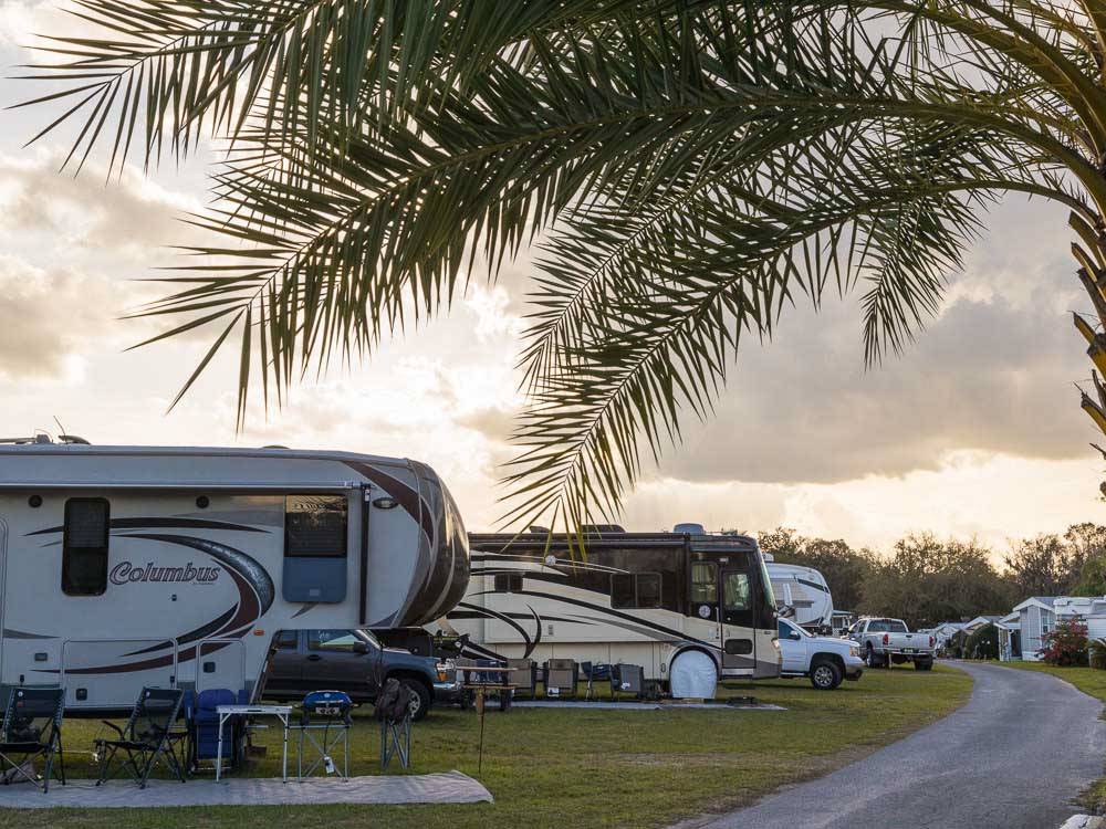 Curving campground road with RVs on the side at HOLIDAY RV VILLAGE