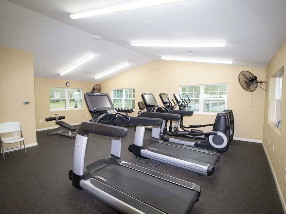 Treadmills and ellipticals in the exercise room at HOLIDAY RV VILLAGE