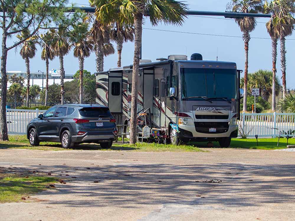 A motorhome backed in at a site at CAMPER'S INN