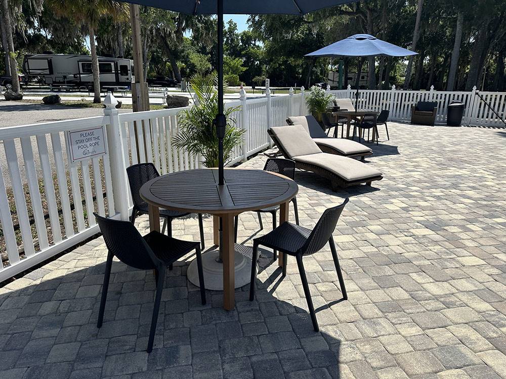 Tables and chairs in the pool area
