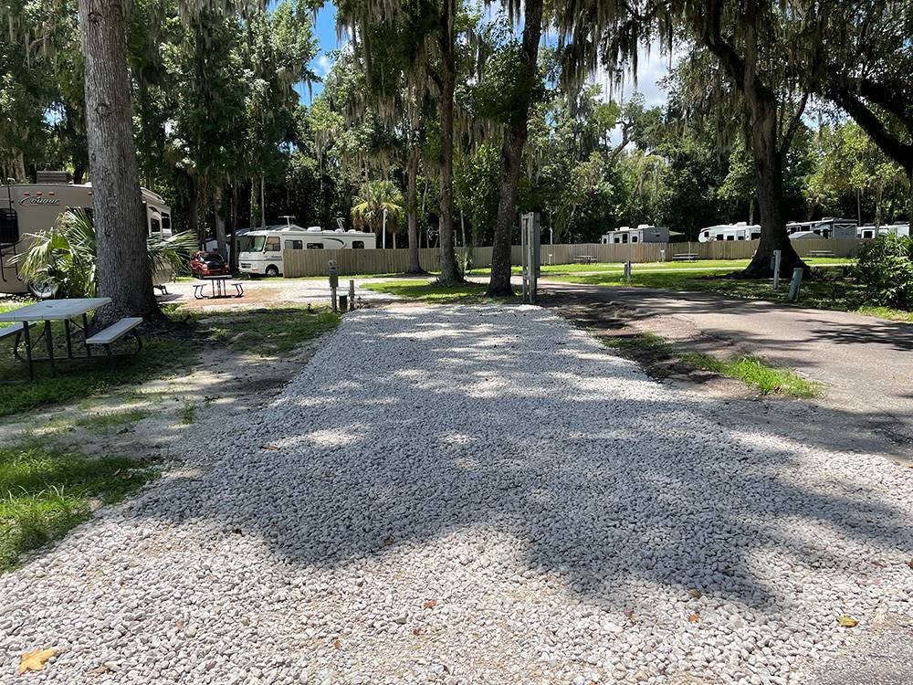 A gravel site and picnic table