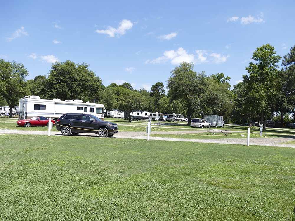 A view of the gravel sites near a grassy area at CUNNINGHAM RV PARK