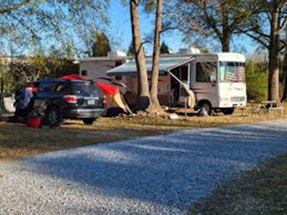 RV parked by trees at Cunningham RV Park