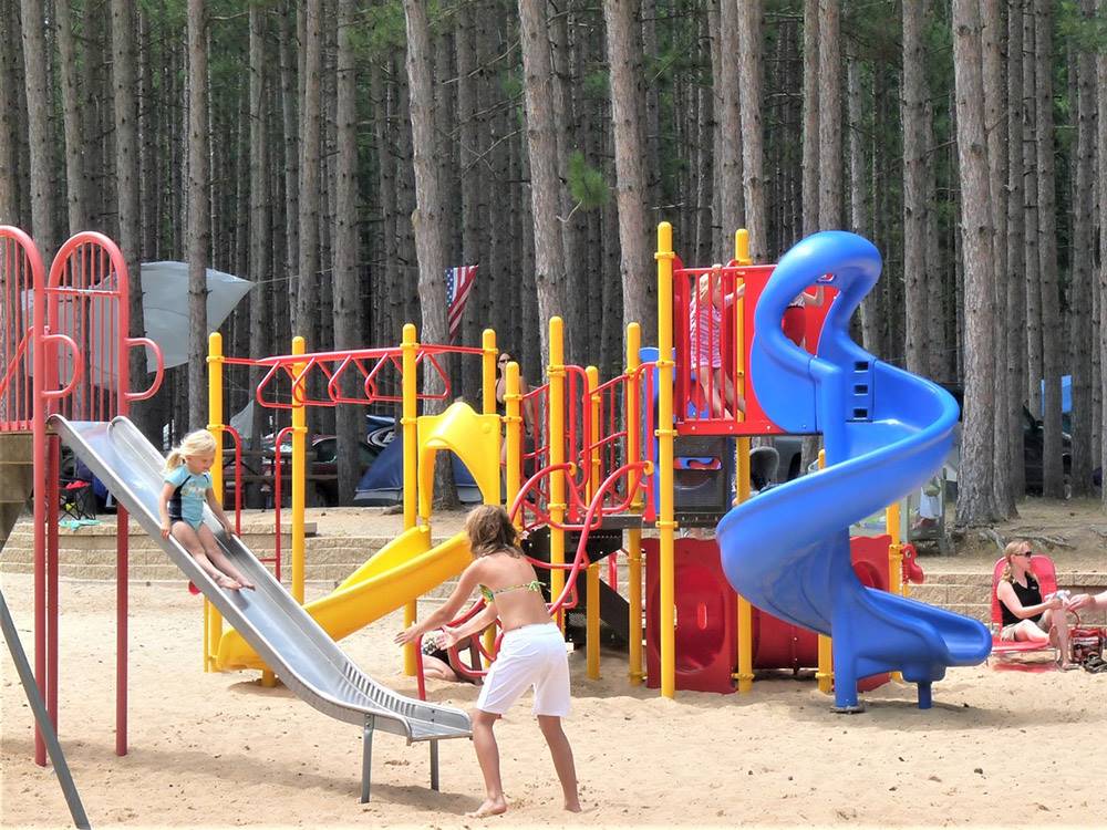 Two girls enjoying the playground at PEARL LAKE RV CAMPGROUND BY RJOURNEY