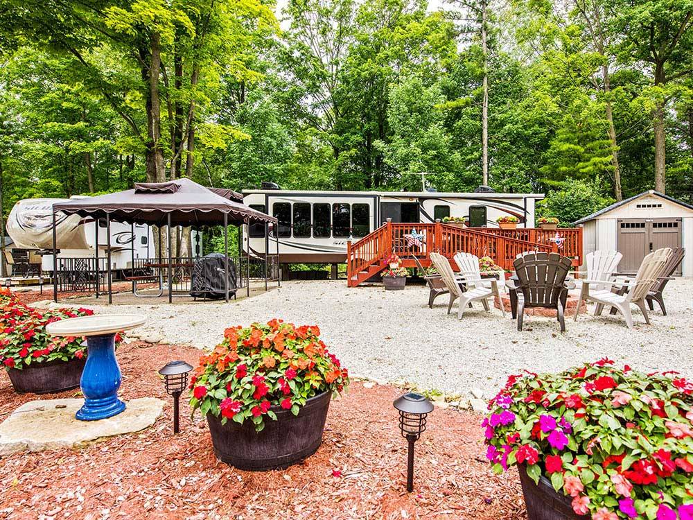 RV site with deck, fire pit and covered picnic area at TRANQUIL TIMBERS