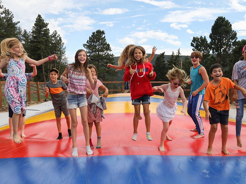 Children on a bounce pad at JELLYSTONE PARK ESTES