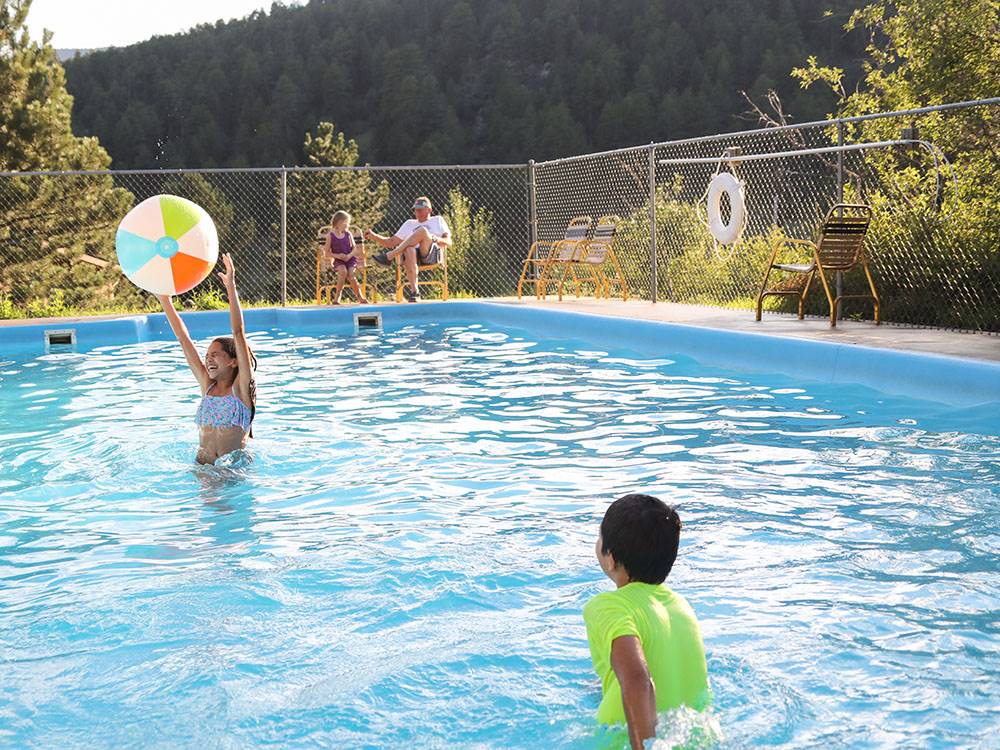 Kids playing in a pool at JELLYSTONE PARK ESTES