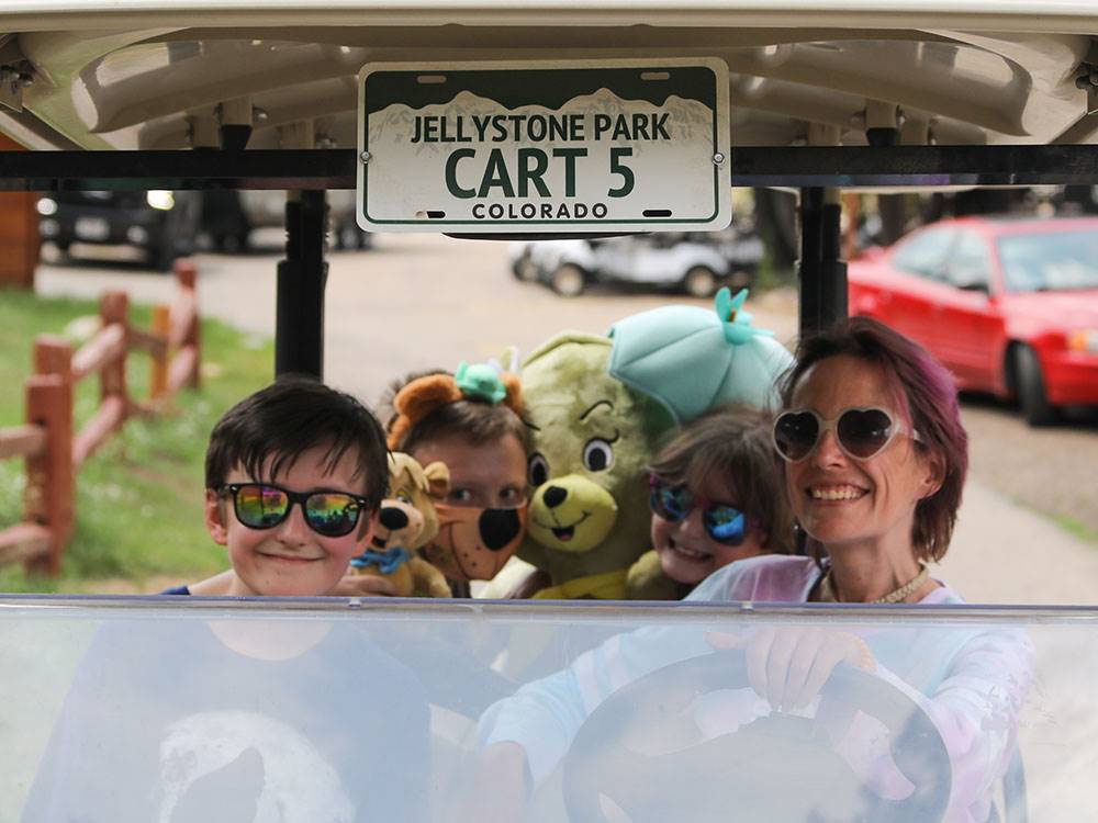 Family driving in a cart at JELLYSTONE PARK ESTES