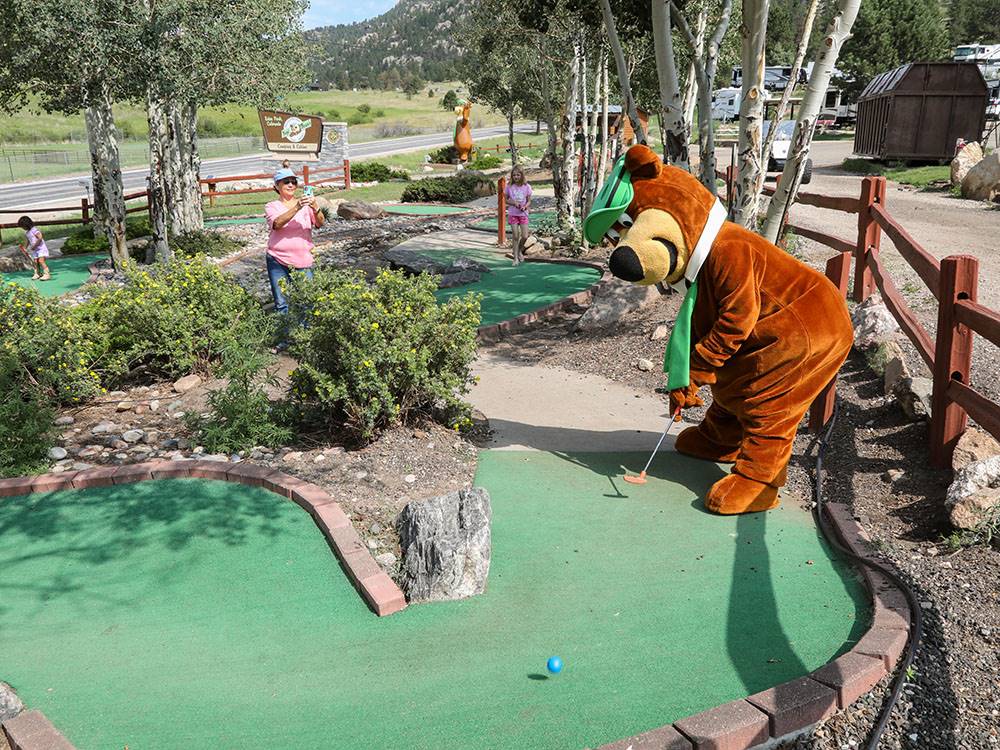 Yogi playing golf at JELLYSTONE PARK ESTES