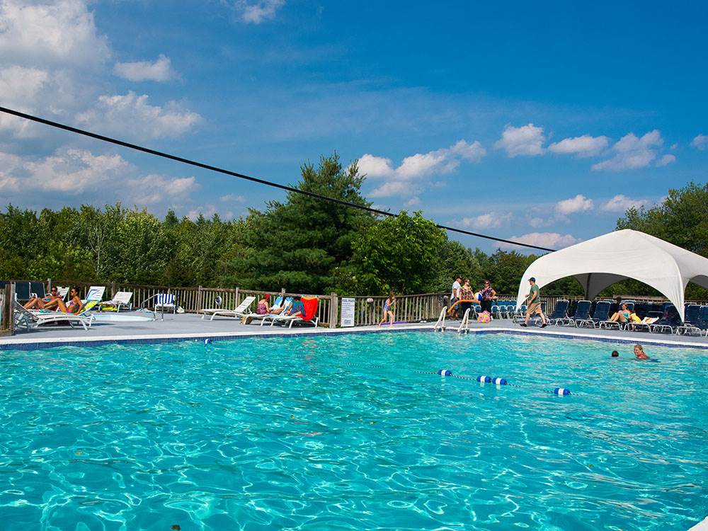 People lounging around the pool
