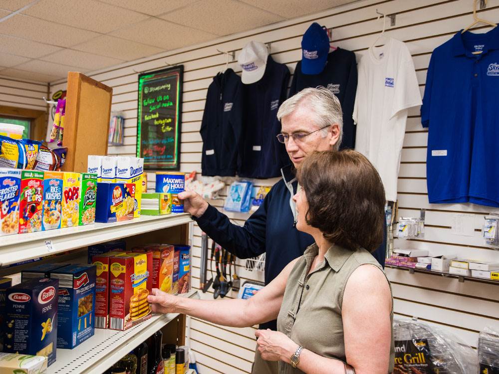 A couple shopping in the camp store