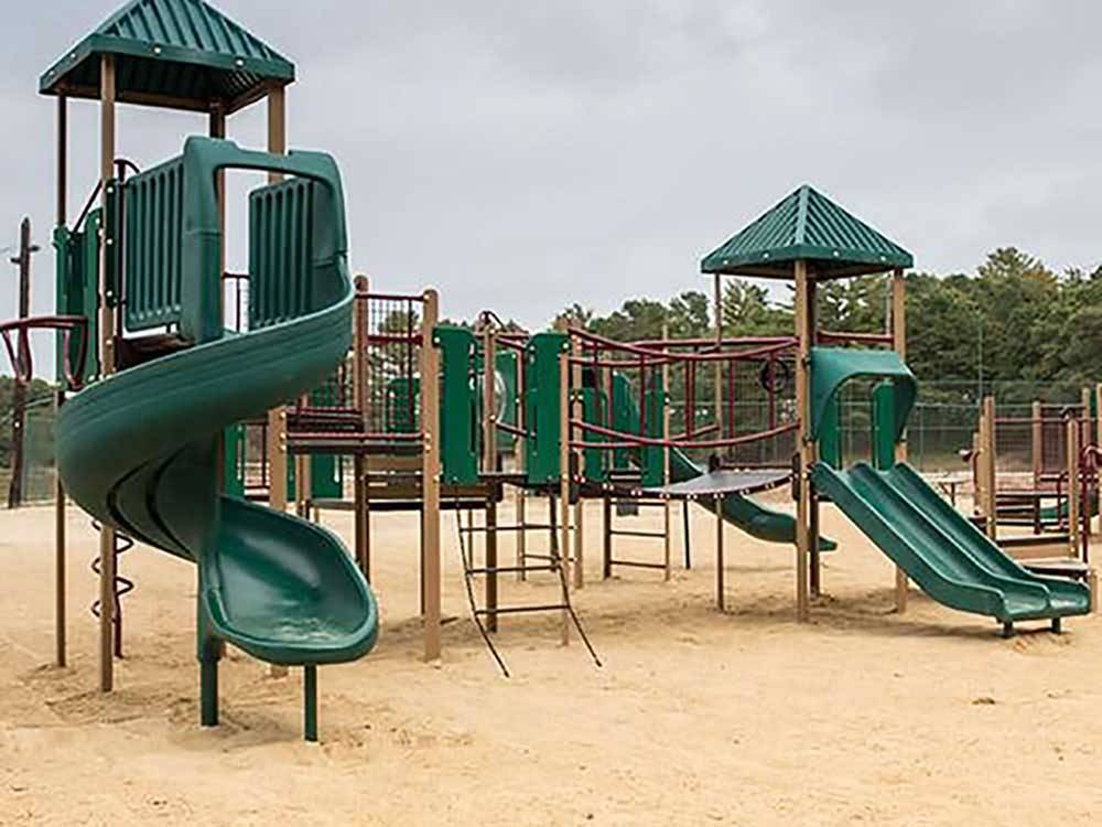 Playground with large swing set at CAPE COD'S MAPLE PARK CAMPGROUND & RV PARK
