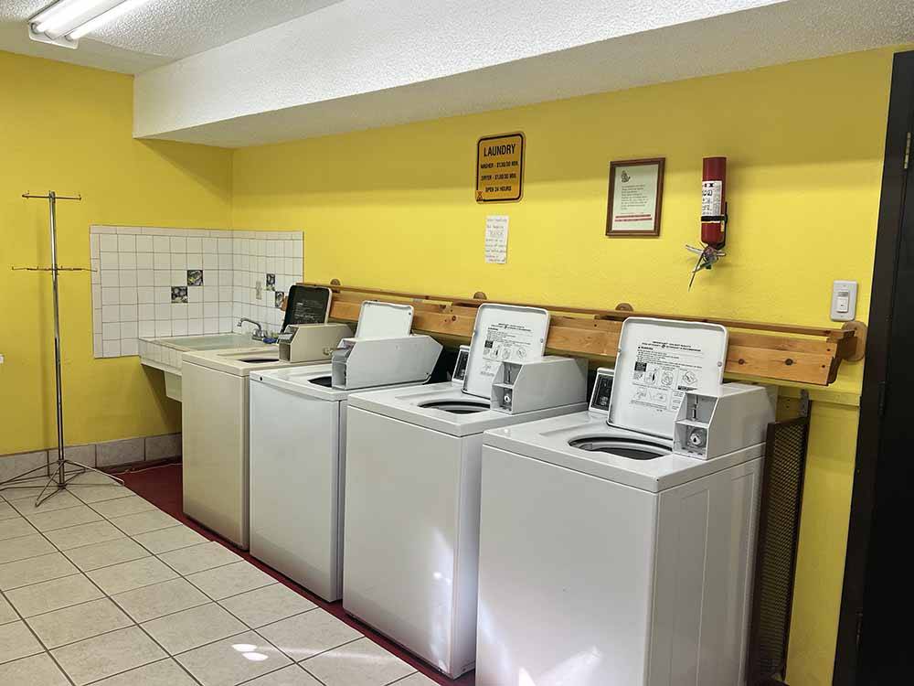 Washers inside the laundry room at LORDSBURG KOA JOURNEY