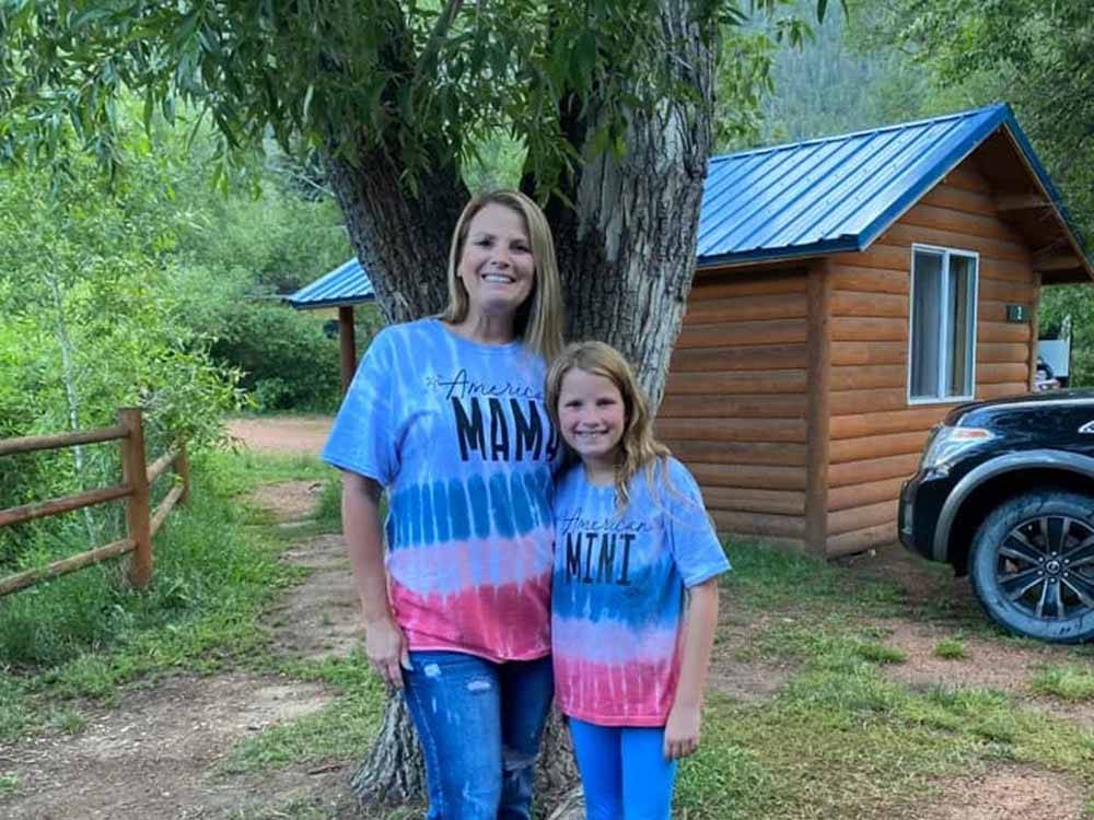 A mother and daughter wearing matching t-shirts at LONE DUCK CAMPGROUND