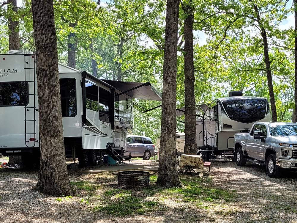Fifth wheel trailers parked in gravel sites at PERRYVILLE RV RESORT BY RJOURNEY