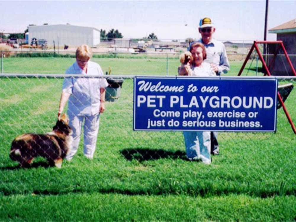 People and dogs inside the pet playground at MIDLAND/ODESSA RV PARK