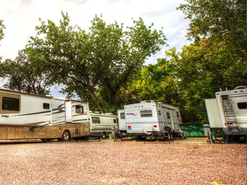 A group of RV sites with motorhomes at GOLDFIELD RV PARK