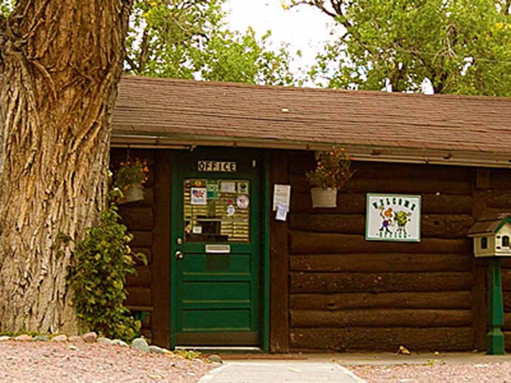 The log cabin office at GOLDFIELD RV PARK